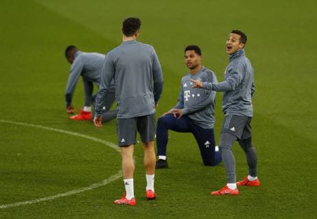 18th February 2019, Anfield, Liverpool, England; UEFA Champions League, Thiago Alcantara shares a joke with Robert Lewandowski during today s open training session at Anfield ahead of tomorrow s Champions League round of 16 first leg match against Liverpool  ActionPlus12106547 AlanxMartin
