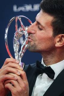 (190219) -- MONACO, Feb. 19, 2019 -- Sportsman of the Year winner Novak Djokovic kisses the trophy after the 2019 Laureus World Sports Awards ceremony in Monaco, Feb. 18, 2019. The 2019 Laureus World Sports Awards were unveiled in Monaco on Monday. ) (SP)MONACO-WORLD SPORTS AWARDS ZhengxHuansong 