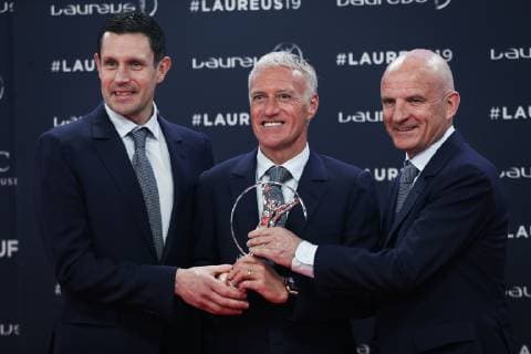 (190219) -- MONACO, Feb. 19, 2019 -- Didier Deschamps (C), manager of France men s national football team, goalkeeper coach Franck Raviot (L) and assistant coach Guy Stephan show the trophy after the France World Cup team winning the Team of the Year award after the 2019 Laureus World Sports Awards ceremony in Monaco, Feb. 18, 2019. The 2019 Laureus World Sports Awards were unveiled in Monaco on Monday. ) (SP)MONACO-WORLD SPORTS AWARDS ZhengxHuansong 