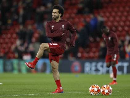 A smiling Mohamed Salah of Liverpool warms up before the UEFA Champions League Round of 16 First Leg match at Anfield Stadium, Liverpool. Picture date: 19th February 2019. Picture credit should read: Darren Staples Sportimage EDITORIAL USE ONLY. No use with unauthorised audio, video, data, fixture lists, club league logos or live services. Online in-match use limited to 120 images, no video emulation. No use in betting, games or single club league player publications. _AZ22972.JPG