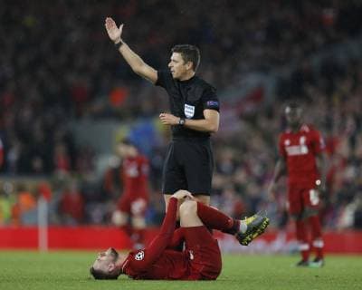 Jordan Henderson of Liverpool goes down injured during the UEFA Champions League Round of 16 First Leg match at Anfield Stadium, Liverpool. Picture date: 19th February 2019. Picture credit should read: Darren Staples Sportimage EDITORIAL USE ONLY. No use with unauthorised audio, video, data, fixture lists, club league logos or live services. Online in-match use limited to 120 images, no video emulation. No use in betting, games or single club league player publications. _AZ23633.JPG