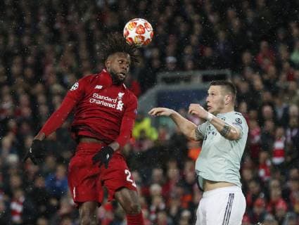 Divock Origi of Liverpool gets above Niklas Sule of Bayern Munich during the UEFA Champions League Round of 16 First Leg match at Anfield Stadium, Liverpool. Picture date: 19th February 2019. Picture credit should read: Darren Staples Sportimage EDITORIAL USE ONLY. No use with unauthorised audio, video, data, fixture lists, club league logos or live services. Online in-match use limited to 120 images, no video emulation. No use in betting, games or single club league player publications. _AZ13033.JPG