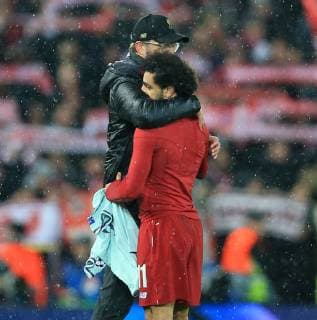 19th February 2019, Anfield, Liverpool, England; UEFA Champions League round of 16, Liverpool versus Bayern Munich; Liverpool manager Jurgen Klopp hugs Mohamed Salah of Liverpool at the final whistle  ActionPlus12106852 DavidxBlunsden