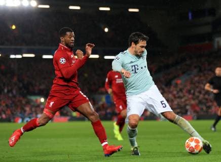 19th February 2019, Anfield, Liverpool, England; UEFA Champions League round of 16, Liverpool versus Bayern Munich; Mats Hummels of Bayern Munich hooks the ball clear as Georginio Wijnaldum of Liverpool challenges  ActionPlus12106884 DavidxBlunsden