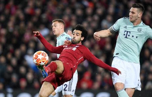 FOOTBALL CHAMPIONS LEAGUE SAISON 2018 2019 ACHTELFINAL HINSPIEL FC Liverpool FC Bayern Muenchen 19 02 2019 Mohamed Salah middle FC Liverpool against Joshua Kimmich li FC Bayern Muenchen and Niklas Suele re FC Bayern Muenchen
