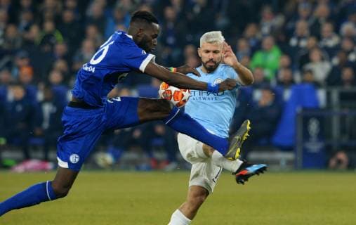 Football UEFA Champions League Men Season 2018 2019 Round of sixteen First leg VELTINS Arena Gelsenkirchen FC Schalke 04 S04 blue Manchester City light blue Salif Sane S04 Sergio Agüero MAC Action DFL REGULATIONS PROHIBIT ANY USE OF PHOTOGRAPHS AS IMAGE SEQUENCES AND OR QUASI VIDEO