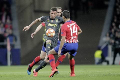 Atletico de Madrid s Juanfran Torres and Rodrigo Hernandez and Juventus Mario Mandzukic during a UEFA Champions League match. Round of 16. February, 20,2019.  (2019022014)