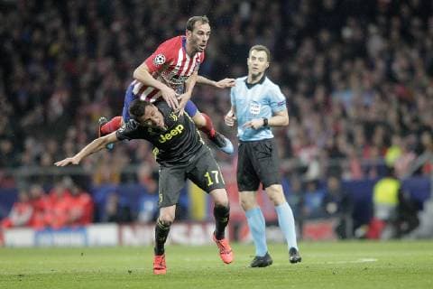 Atletico de Madrid s Juanfran Torres and Juventus Mario Mandzukic during a UEFA Champions League match. Round of 16. February, 20,2019.  (2019022015)