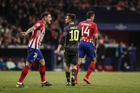20th February 2019, Wanda Metropolitano, Madrid, Spain; UEFA Champions League football, Atletico Madrid versus Juventus; Paulo Dybala (Juventus) argues with Gim& xe9;nez (atletico) about a challenge  ActionPlus12107014 LeonardoxPrieto