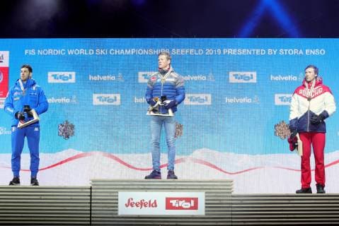 Nordische Ski WM in Seefeld, Langlauf Sprint Herren, Siegerehrung TYROL, AUSTRIA - FEBRUARY 22, 2019: Silver medallist Federico Pellegrini of Italy (L), gold medal winner Johannes Hoesflot Klaebo of Norway (C), and bronze medallist Gleb Retivykh of Russia during the victory ceremony for the men s 1.6km sprint free final at the 2019 FIS Nordic World Ski Championships in Seefeld, Tyrol, Austria. Sergei Bobylev TASS  TS0A1F9B