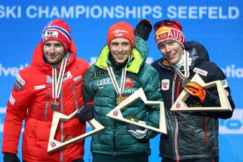 NORDIC SKIING - FIS Nordic World Ski Championships Seefeld 2019 SEEFELD,AUSTRIA,22.FEB.19 - NORDIC SKIING, NORDIC COMBINED - FIS Nordic World Ski Championships, medal plaza, award ceremony, 10km Gundersen, large hill. Image shows Jan Schmid (NOR), Eric Frenzel (GER) and Franz-Josef Rehrl (AUT). Keywords: medal. GEPAxpictures xCh.xKelemen