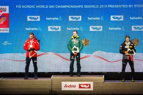 NORDIC SKIING - FIS Nordic World Ski Championships Seefeld 2019 SEEFELD,AUSTRIA,22.FEB.19 - NORDIC SKIING, NORDIC COMBINED - FIS Nordic World Ski Championships, medal plaza, award ceremony, 10km Gundersen, large hill. Image shows Jan Schmid (NOR), Eric Frenzel (GER) and Franz-Josef Rehrl (AUT). GEPAxpictures xPhilippxBrem