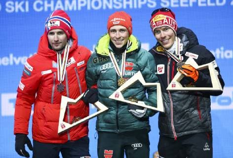 NORDIC SKIING - FIS Nordic World Ski Championships Seefeld 2019 SEEFELD,AUSTRIA,22.FEB.19 - NORDIC SKIING, CROSS COUNTRY SKIING - FIS Nordic World Ski Championships, medal plaza, award ceremony, sprint, men. Image shows Jan Schmid (NOR), Eric Frenzel (GER) and Franz-Josef Rehrl (AUT). GEPAxpictures xCh.xKelemen