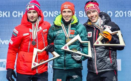 22 02 2019 Medal Plaza Seefeld AUT FIS World Championships Ski Nordic Seefeld 2019 Nordic Combination Award Ceremony in picture v l Silver Medal Winner Jan Schmid NOR World Champion and Gold Medal Winner Eric Frenzel GER Bronze Medal Winner Franz Josef Rehrl AUT f l Silver medalist Jan Schmid of Norway World champion and gold medalist Eric Frenzel of Germany Bronze medalist Franz Josef Rehrl of Austria during the winner Ceremony for the Nordic Combined competition of FIS Nordic Ski World Championships 2019 at the Medal Plaza in Seefeld Austria on 2019 02 22 Seefeld  EX_ANG