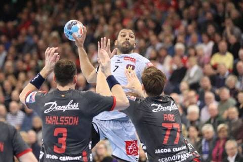 SG Flensburg Handewitt vs. HBC Nantes Handball EHF Champions League Group Phase 27 02 19 Nicolas Claire HBC Nantes 07 against Tobias Karlsson SG Flensburg Handewitt 03 and Magnus Roed SG Flensburg Handewitt 77 xmmkx
