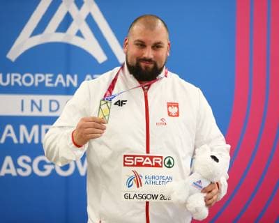 2nd March 2019, Emirates Arena, Glasgow, Scotland; European Athletics Indoor Championships, day 2; Michal Haratyk (POL) with the gold medal for the mens Shot Put event  ActionPlus12109864 VagelisxGeorgariou