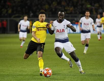 Jadon Sancho of Borussia Dortmund tackled by Davinson Sanchez of Tottenham during the UEFA Champions League Round of Sixteen match at the Signal Iduna Park Stadium, Dortmund. Picture date: 5th March 2019. Picture credit should read: David Klein Sportimage EDITORIAL USE ONLY. No use with unauthorised audio, video, data, fixture lists, club league logos or live services. Online in-match use limited to 120 images, no video emulation. No use in betting, games or single club league player publications. _1DK3604.JPG