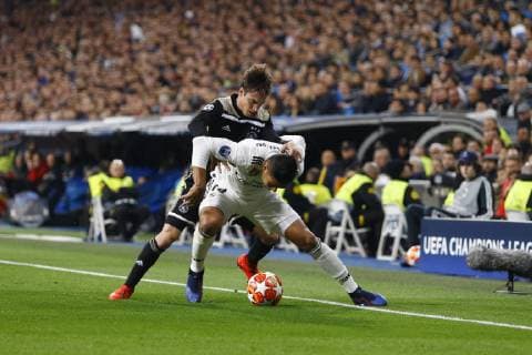 Real Madrid CF s Carlos H. Casemiro and AFC Ajax s Nicolas Tagliafico during UEFA Champions League match, Round of 16, 2nd leg between Real Madrid and AFC Ajax at Santiago Bernabeu Stadium in Madrid, Spain. March 05, 2019.  (20190305282)