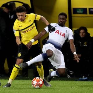 (190306) -- DORTMUND, March 6, 2019 (Xinhua) -- Jadon Sancho (L) of Dortmund vies with Serge Aurier of Tottenham Hotspurs during the UEFA Champions League round of 16 second leg soccer match between Borussia Dortmund and Tottenham Hotspur FC in Dortmund, Germany, March 5, 2019. (Xinhua Joachim Bywaletz) (SP)GERMANY-DORTMUND-SOCCER-UEFA-CHAMPIONS LEAGUE-DORTUMUND VS HOTSPUR 