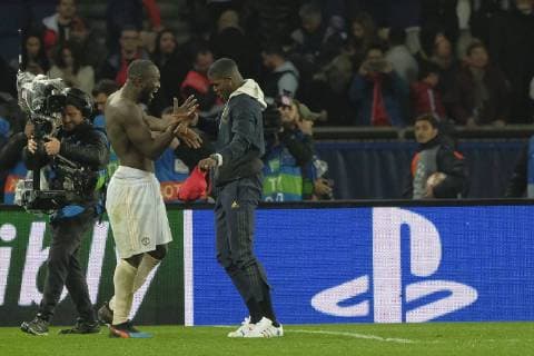 March 6, 2019 - Paris, France - Manchester United ManU midfielder PAUL POGBA suspended for the match congratulated Manchester United striker ROMELU LUKAKU in the round of 16 Second leg of the Champions League Paris SG against Manchester United at Parc des Princes Stadium..Manchester United won 3-1 Soccer 2019 - Paris SG 1-3 Manchester United - ZUMAp119 20190306_zaf_p119_014 Copyright: xPierrexSteveninx