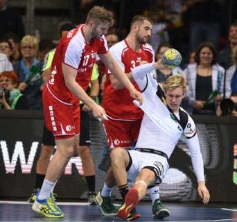 Handball international match in Düsseldorf Germany Switzerland 09 03 2019 Marian Michalczik Deut is brought down by Röthlisberger li and champion both Switzerland HM