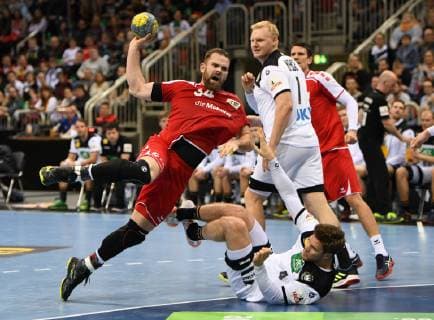 Handball international in Düsseldorf Germany Switzerland 09 03 2019 Alen Milosevic Switzerland sits down on the throwing circle against James Golla on the ground by back Patrick Wiencek both Deut HM