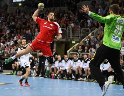 Handball international in Düsseldorf Germany Switzerland 09 03 2019 Lucas Champion Switzerland gets free to throw against Tw Christoph Rudeck Deut HM