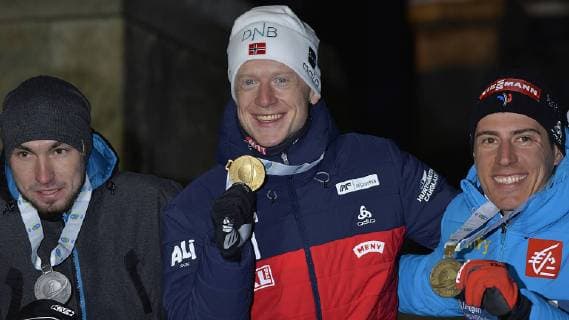 Biathlon World Championships in Östersund Sweden Mens sprint award ceremony 09 03 2019 Alexander Loginow Alexander Loginov Russia li Johannes Thingnes Boe Norway Mitte and Quentin Fillon Maillet France at Medals Ceremony after mens sprint race during Biathlon World Championships in Östersund Sweden 09 03 2019 Östersund Jämtland Sweden Medals Plaza