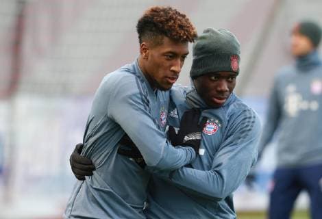 Kingsley Coman li and Renato Sanches embrace football FC Bayern Munich final training before CL match against Liverpool FC 12 03 2019
