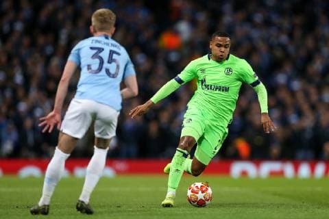 Weston McKennie (r) of FC Schalke 04 runs at Oleksandr Zinchenko of Manchester City during the UEFA Champions League Round of 16 match at the Etihad Stadium, Manchester. Picture date: 12th March 2019. Picture credit should read: James Wilson Sportimage EDITORIAL USE ONLY. No use with unauthorised audio, video, data, fixture lists, club league logos or live services. Online in-match use limited to 120 images, no video emulation. No use in betting, games or single club league player publications. SPI_0384.JPG