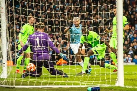Manchester City v FC Schalke 04 UEFA Champions League Sergio Aguero of Manchester City strikes the ball through the legs of FC Schalke 04 goalkeeper Ralf Fahrmann for his sides second goal during the UEFA Champions League match at the Etihad Stadium, Manchester Content Not Available For UK Newspapers Copyright: xMattxWilkinsonx FIL-12983-0020