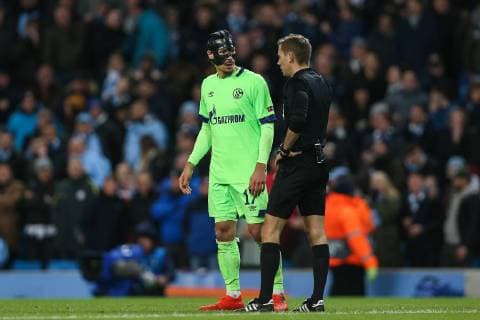 Benjamin Stambouli of FC Schalke 04 talks to referee Clement Turpin whilst a VAR decision is being made during the UEFA Champions League Round of 16 match at the Etihad Stadium, Manchester. Picture date: 12th March 2019. Picture credit should read: James Wilson Sportimage EDITORIAL USE ONLY. No use with unauthorised audio, video, data, fixture lists, club league logos or live services. Online in-match use limited to 120 images, no video emulation. No use in betting, games or single club league player publications. SPI_0303.JPG