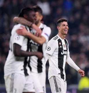 (190313) -- TURIN, March 13, 2019 (Xinhua) -- Juventus s Cristiano Ronaldo (R) celebrates after scoring during the UEFA Champions League round 16 second leg match between Juventus and Atletico Madrid in Turin, Italy, Mar.12, 2018. Juventus won 3-0. (Xinhua Alberto Lingria) (SP)ITALY-TURIN-SOCCER-UEFA CHAMPIONS LEAGUE-JUVENTUS VS ATLETICO MADRID 