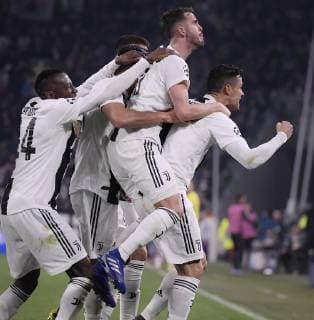 (190313) -- TURIN, March 13, 2019 (Xinhua) -- Juventus s Cristiano Ronaldo (R) celebrates after scoring during the UEFA Champions League round 16 second leg match between Juventus and Atletico Madrid in Turin, Italy, Mar.12, 2018. Juventus won 3-0. (Xinhua Alberto Lingria) (SP)ITALY-TURIN-SOCCER-UEFA CHAMPIONS LEAGUE-JUVENTUS VS ATLETICO MADRID 