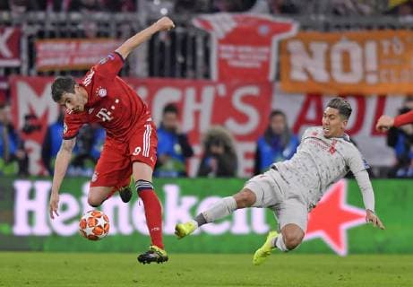 13 03 2019 Football UEFA Champions League 2018 2019 Round of sixteen return FC Bayern Munich FC Liverpool in the Allianz Arena Munich v left Robert Lewandowski FC Bayern Munich against Roberto Firmino FC Liverpool DFL and DFB regulations prohibit any use of photographs as image sequences and or quasi video