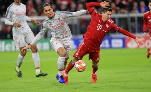 13 03 2019 Football UEFA Champions League 2018 2019 Round of sixteen return FC Bayern Munich FC Liverpool in the Allianz Arena Munich Virgil van Dijk li FC Liverpool foult Robert Lewandowski FC Bayern Munich in the penalty area DFL and DFB regulations prohibit any use of photographs as image sequences and or quasi video
