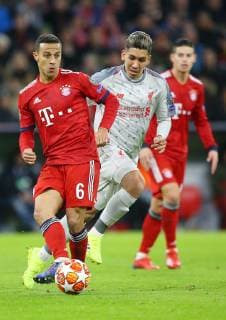 SOCCER - CL, Bayern vs Liverpool MUNICH,GERMANY,13.MAR.19 - SOCCER - UEFA Champions League, round of 16, FC Bayern Muenchen vs Liverpool FC. Image shows Thiago (Bayern) and Roberto Firmino (Liverpool). GEPAxpictures xThomasxBachun