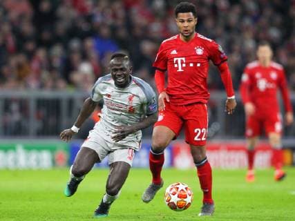 Bayern Munich v Liverpool UEFA Champions League Serge Gnabry of Bayern Munich and Sadio Mane of Liverpool during the UEFA Champions League match at Allianz Arena, Munich Content Not Available For UK Newspapers Copyright: xYannisxHalasx FIL-12994-0019