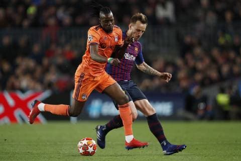 (l-r) Bertrand Traore of Olympique Lyonnais, Ivan Rakitic of FC Barcelona Barca during the UEFA Champions League round of 16 match between FC Barcelona and Olympique Lyonnais at Camp Nou on March 13, 2019 in Barcelona, Spain UEFA Champions League 2018 2019 xVIxVIxImagesx xMauricexvanxSteenxIVx 13899166