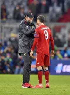 13 03 2019 Football UEFA Champions League 2018 2019 Round of sixteen return FC Bayern Munich FC Liverpool in the Allianz Arena Munich Coach Jürgen Klopp Liverpool comforts after the match Robert Lewandowski FC Bayern Munich DFL and DFB regulations prohibit any use of photographs as image sequences and or quasi video