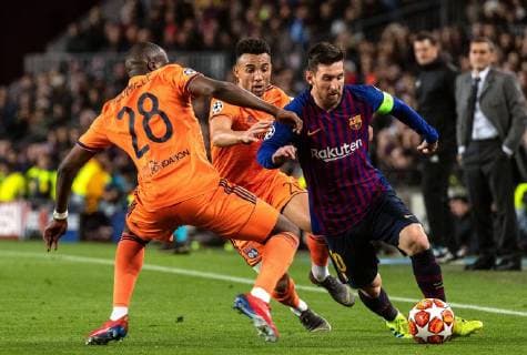 (190314) -- BARCELONA, March 14, 2019 -- Barcelona s Lionel Messi (R) vies with Lyon s Tanguy NDombele (L) and Fernando Marcal during the UEFA Champions League match between Spanish team FC Barcelona Barca and French team Lyon in Barcelona, Spain, on March 13, 2019. Barcelona won 5-1 and advanced to the quarterfinals. ) (SP)SPAIN-BARCELONA-SOCCER-UEFA CHAMPIONS LEAGUE-1 8 FINALS-BARCELONA VS LYON JoanxGosa 