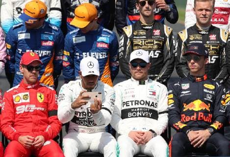 (190317) -- MELBOURNE, March 17, 2019 -- Mercedes driver Lewis Hamilton of Britain takes photos with his cell phone as drivers pose for a group photo ahead of the Formula 1 Australian Grand Prix 2019 at the Albert Park in Melbourne, Australia, March 17, 2019. ) (SP)AUSTRALIA-MELBOURNE-F1-GRAND PRIX 2019 BaixXuefei 