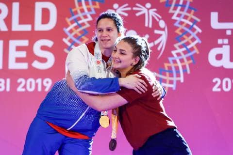 March 17, 2019 - Abu Dhabi, United Arab Emirates - American and Cypriot athletes show their emotions when receiving their medals during declaration ceremony at the Special Olympics World Games in Abu Dhabi National Exhibition Centre, United Arab Emirates on March 17, 2019. Special Olympics is a worldwide organization which organize sports competitions for people with learning difficulties. Summer World Games take place every 4 years. 7500 athletes from nearly 200 countries compete in 24 Olympic disciplines in Abu Dhabi Games in 2019. Opening Ceremony Of Special Olympics 2019 In Abu Dhabi  - ZUMAn230 20190317_zaa_n230_619 Copyright: xDominikaxZarzyckax