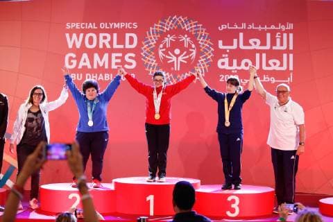 March 17, 2019 - Abu Dhabi, United Arab Emirates - Athletes show their emotions when receiving their medals during declaration ceremony at the Special Olympics World Games in Abu Dhabi National Exhibition Centre. Special Olympics is a worldwide organization which organize sports competitions for people with learning difficulties. Summer World Games take place every 4 years. 7500 athletes from nearly 200 countries compete in 24 Olympic disciplines in Abu Dhabi Games in 2019. Special Olympics In Abu Dhabi 2019  - ZUMAn230 20190317_zaa_n230_728 Copyright: xDominikaxZarzyckax