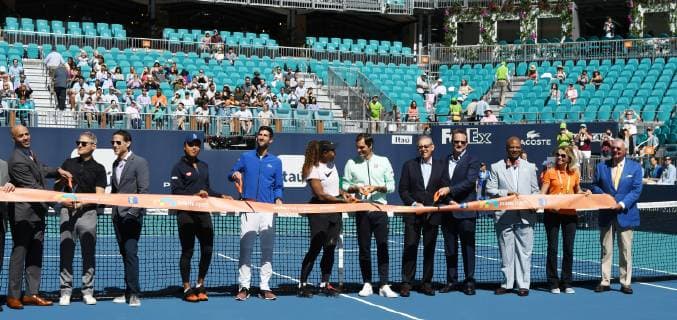 Tennis stars and executives participate in the ribbon cutting ceremony on the center court of the new home of the Miami Open at the Hard Rock Stadium in Miami Gardens, Florida on March 20, 2019. The participants include Roger Federer, Serena Williams, Novak Djokovic and Naomi Osaka. with tournament director James Blake, Miami Dolphins owner Stephen Ross, Endeavor president Mark Shapiro and Endeavor CEO Ari Emanuel.  MIA20190320101 GARYxIxROTHSTEIN