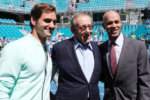 Tennis star Roger Federer, Miami Dolphins owner Stephen Ross and tournament director James Blake pose for a photograph after participating in the ribbon cutting ceremony on the center court of the new home of the Miami Open at the Hard Rock Stadium in Miami Gardens, Florida on March 20, 2019.  MIA20190320103 GARYxIxROTHSTEIN