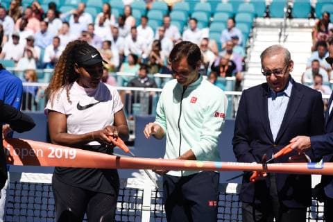 MIAMI GARDENS, FL - MARCH 20: Serena Williams, left, Roger Federer and Stephen Ross attend the ribbon cutting for Stadium Court at the Miami Open on March 20, 2019 at Hard Rock Stadium in Miami Gardens, FL. (Photo by Michele Eve Sandberg Icon Sportswire) TENNIS: MAR 20 Miami Open Icon190320092