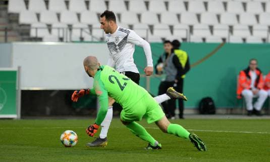 Football Germany Men Season 2018 2019 Stadion Essen International match U21 Germany white France blue Lebin Öztunali GER scores goal to 1-0 against Paul Bernardoni FRA Action UEFA REGULATIONS PROHIBIT ANY USE OF PHOTOGRAPHS AS IMAGE SEQUENCES AND OR QUASI VIDEO