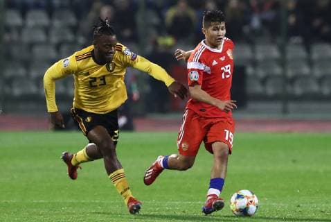 BRUSSELS, BELGIUM â€“ MARCH 21, 2019: Belgium s Michy Batshuayi (L) and Russia s Ilzat Akhmetov in action in their UEFA EURO EM Europameisterschaft Fussball 2020 qualifying football match at King Baudouin Stadium. Anton Novoderezhkin TASS  TS0A571B