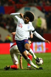 Hamza Choudhury of England U21s is tackled during the International Friendly Länderspiel match between England U21 U 21 and Poland U21 at Ashton Gate, Bristol, England on 21 March 2019. Copyright: xDavexPetersx 23440047